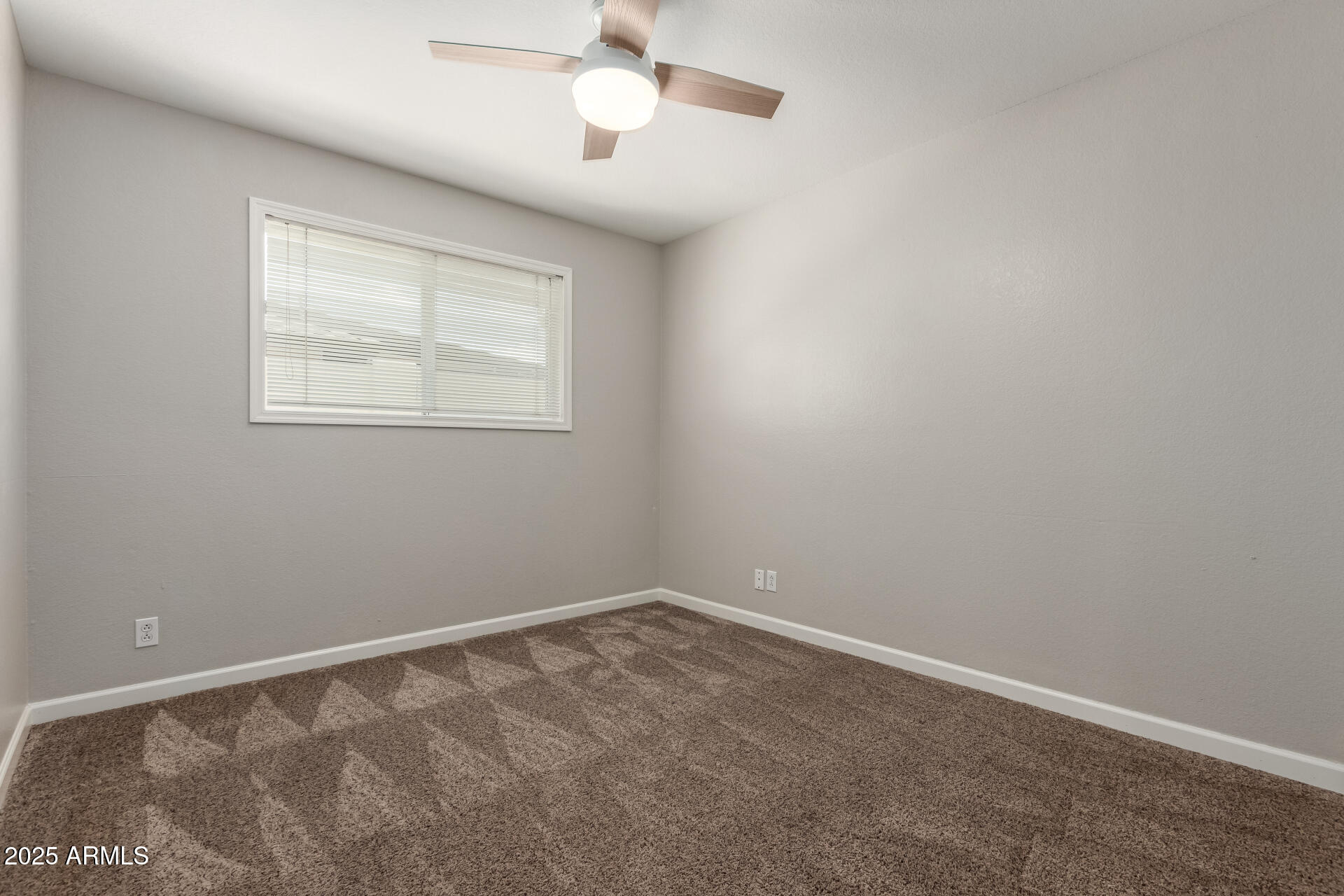 1237 East Gemini Drive Tempe, AZ 85283 - Photo 35 of 51 an empty room with a window and ceiling fan