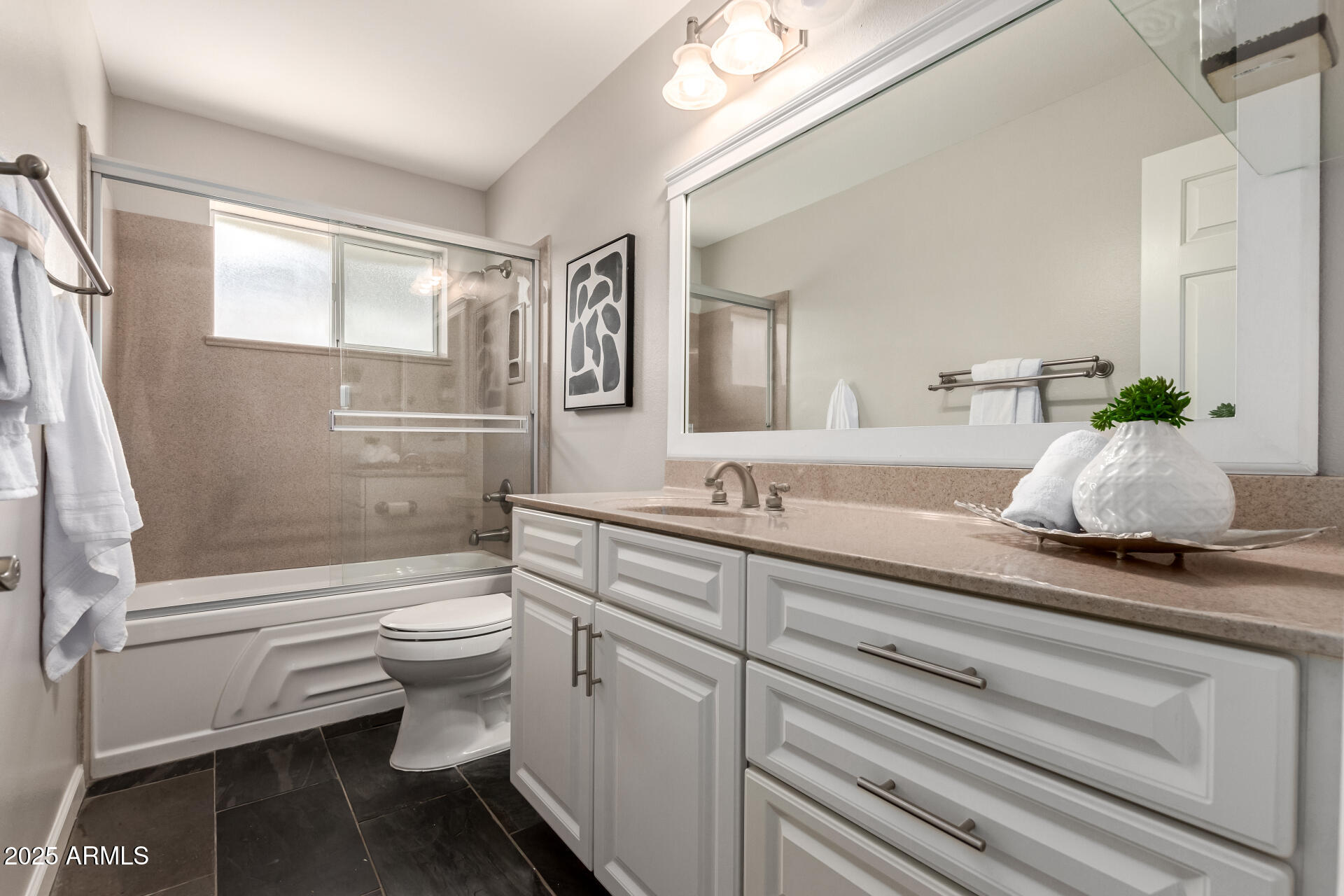 1237 East Gemini Drive Tempe, AZ 85283 - Photo 37 of 51 a bathroom with a sink a toilet and bathtub