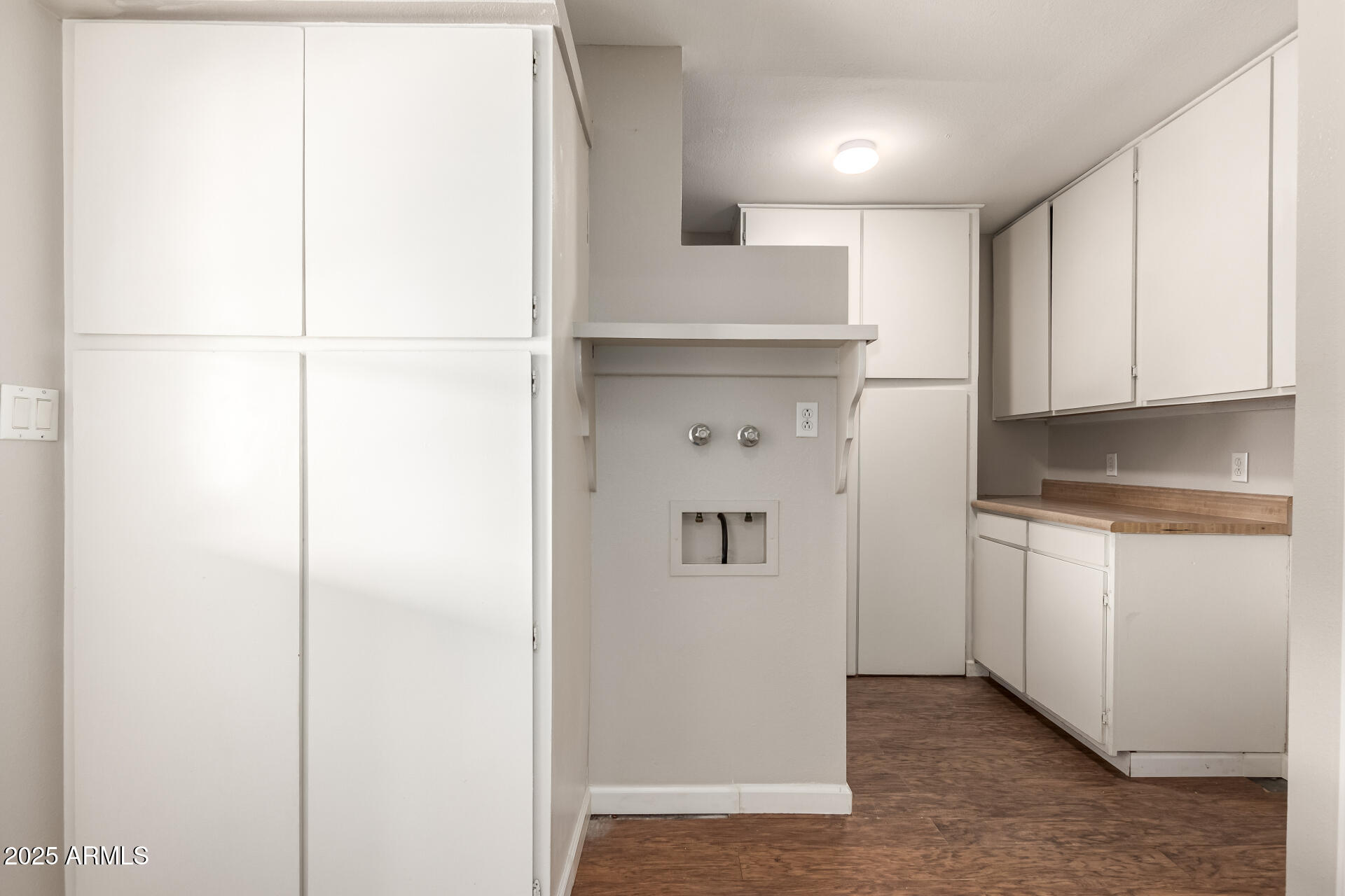 1237 East Gemini Drive Tempe, AZ 85283 - Photo 38 of 51 a kitchen with a refrigerator and white cabinets