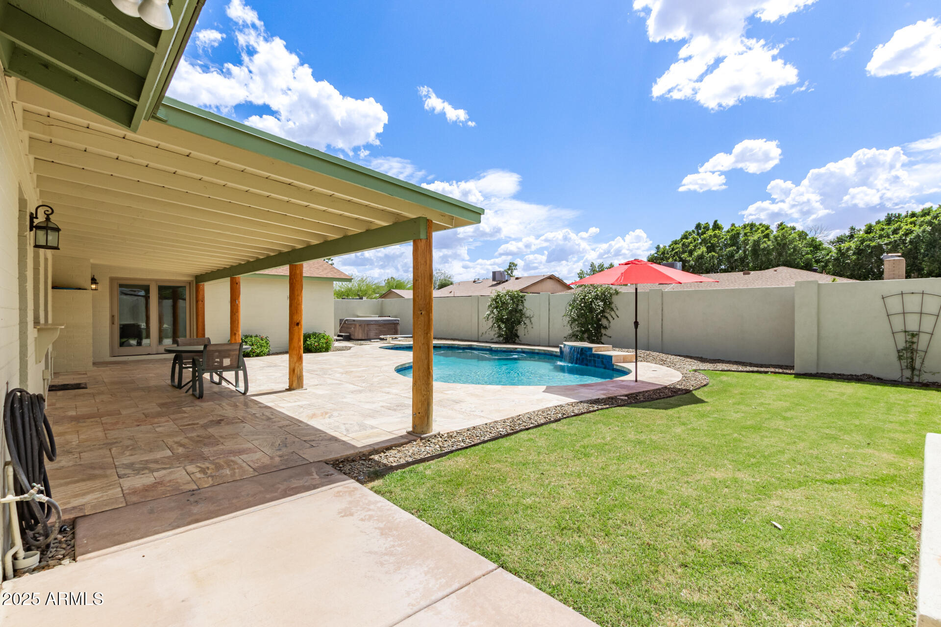 1237 East Gemini Drive Tempe, AZ 85283 - Photo 43 of 51 a backyard of a house with table and chairs