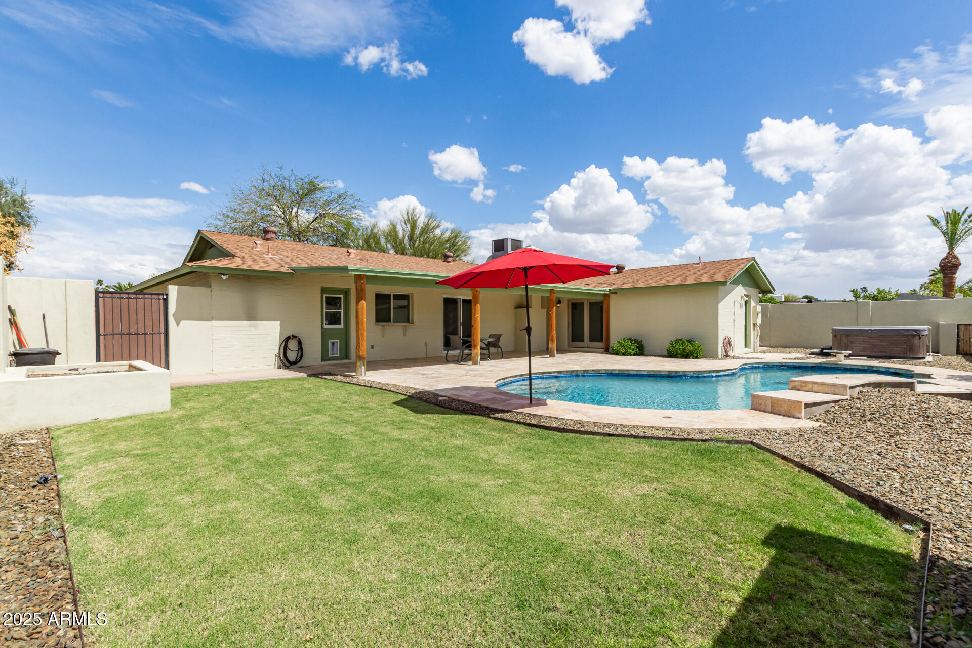 1237 East Gemini Drive Tempe, AZ 85283 - Photo 44 of 51 a view of a house with swimming pool and a yard