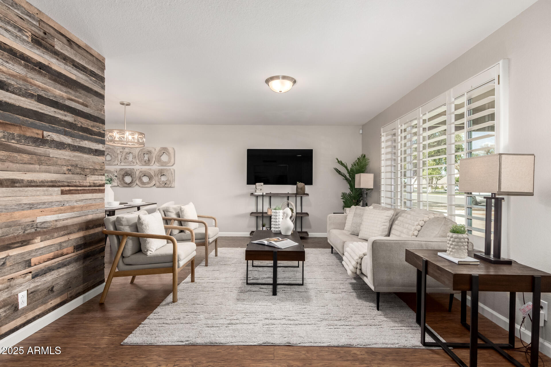 1237 East Gemini Drive Tempe, AZ 85283 - Photo 7 of 51 a living room with furniture a flat screen tv and a fireplace