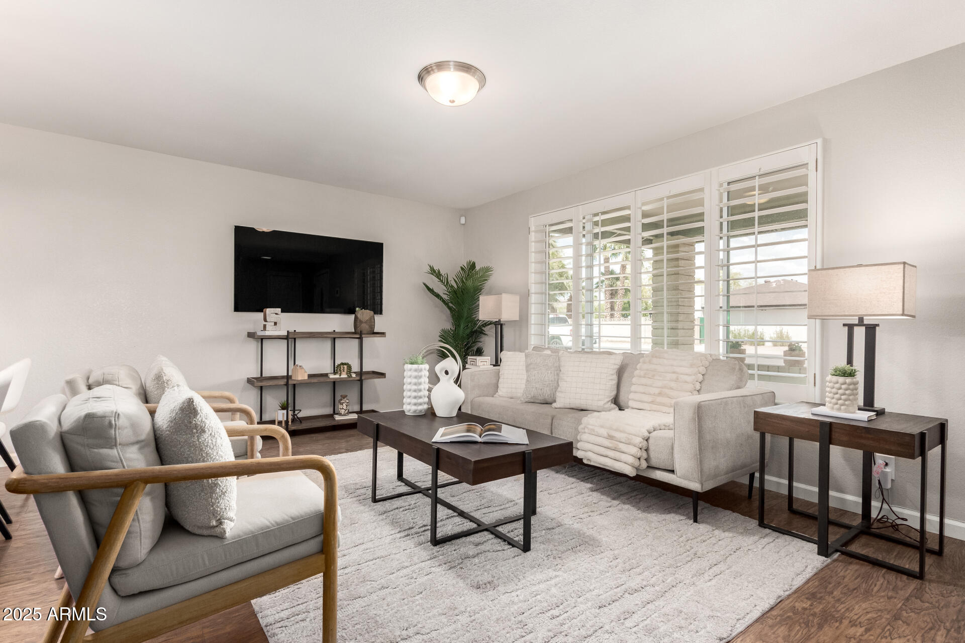 1237 East Gemini Drive Tempe, AZ 85283 - Photo 8 of 51 a living room with furniture a flat screen tv and a large window