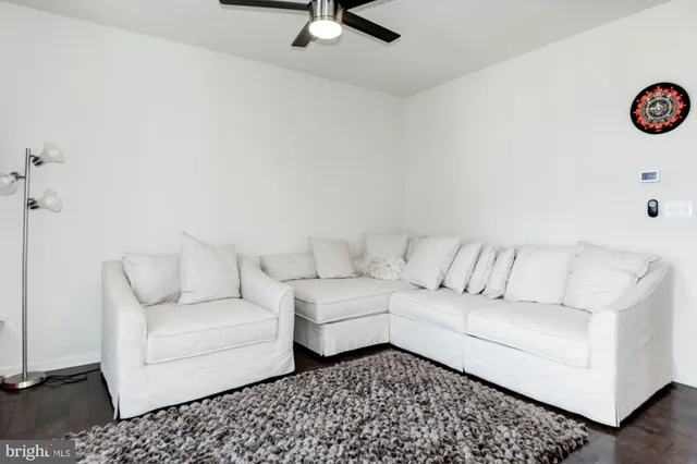 a living room with couch and a table