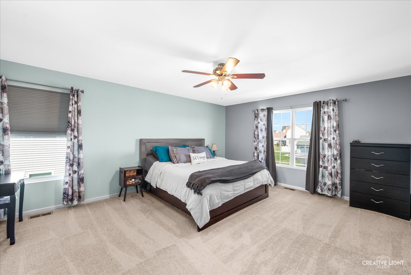 1615 Seward Road Joliet, IL 60431 - Photo 19 of 31 a spacious bedroom with a bed and a table