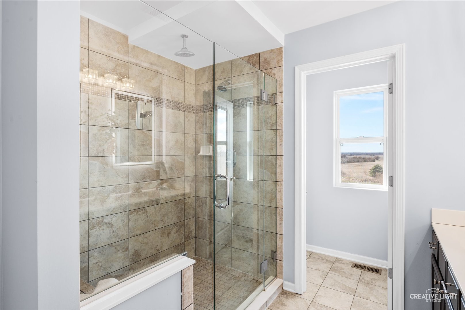 1615 Seward Road Joliet, IL 60431 - Photo 20 of 31 a bathroom with a glass shower door