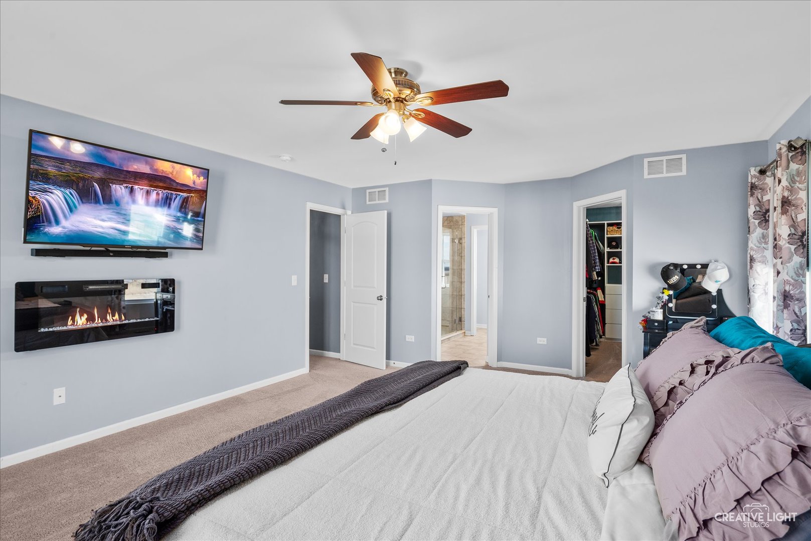 1615 Seward Road Joliet, IL 60431 - Photo 21 of 31 a bedroom with a bed and a flat screen tv