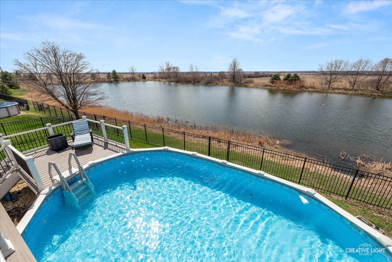 1615 Seward Road Joliet, IL 60431 - Photo 30 of 31 a view of a swimming pool with a lake view