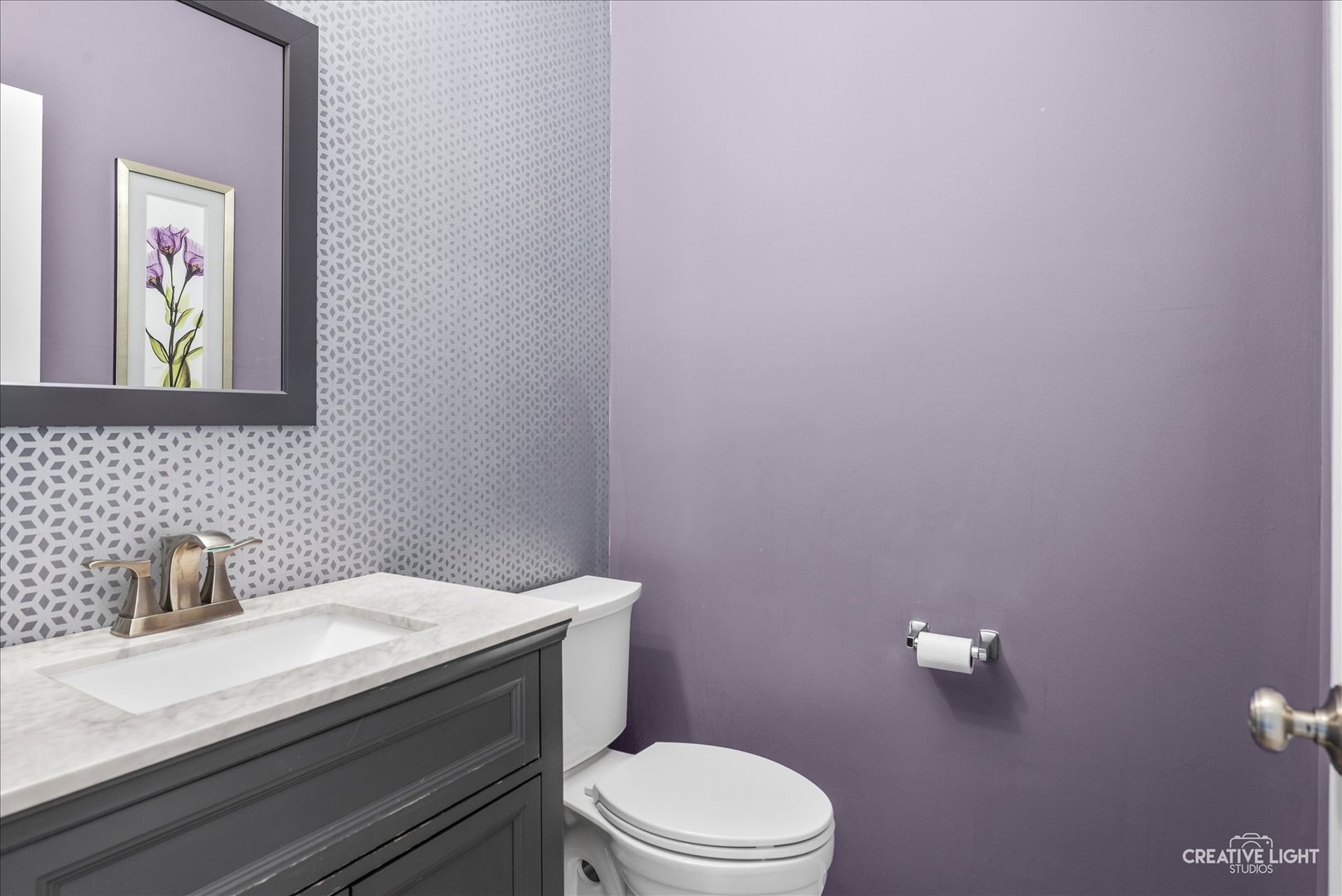 1615 Seward Road Joliet, IL 60431 - Photo 8 of 31 a bathroom with a toilet a sink and mirror