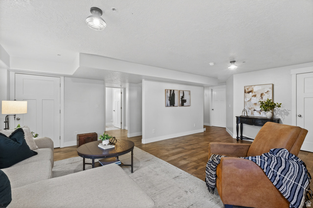 681 Island Road Morgan, UT 84050 - Photo 20 of 49 Spacious living area featuring wood-finish flooring, light gray walls, white trim, and recessed lighting
