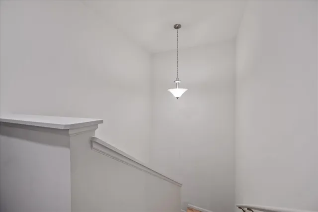 a view of a hallway with a window