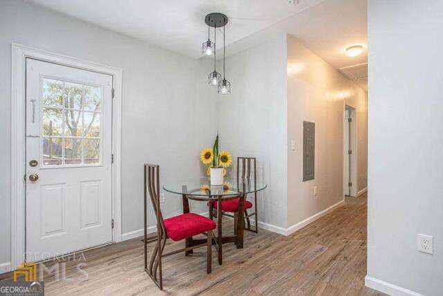 6236 Front Street Douglasville, GA 30134 - Photo 12 of 30 a view of a room with wooden floor furniture and windows
