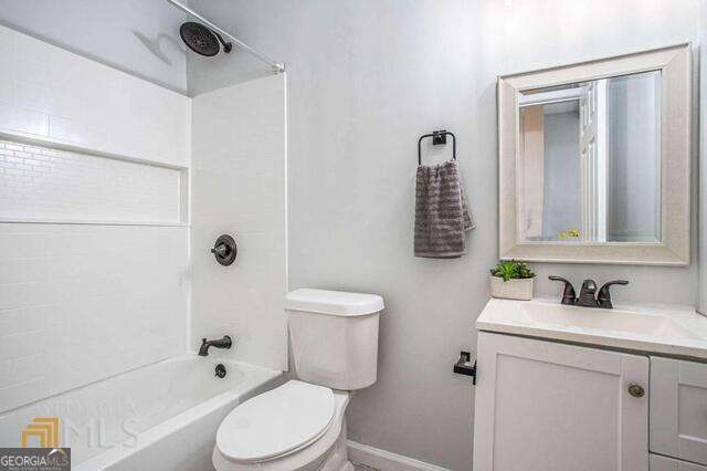 6236 Front Street Douglasville, GA 30134 - Photo 16 of 30 a bathroom with a sink toilet and shower