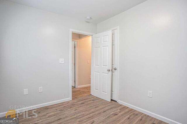 6236 Front Street Douglasville, GA 30134 - Photo 17 of 30 a view of an empty room and wooden floor