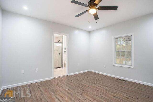 6236 Front Street Douglasville, GA 30134 - Photo 24 of 30 an empty room with windows and fan