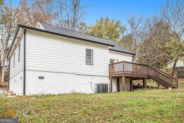 6236 Front Street Douglasville, GA 30134 - Photo 29 of 30 a house that has a large tree in front of it