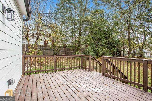 6236 Front Street Douglasville, GA 30134 - Photo 30 of 30 a view of balcony with wooden floor and fence
