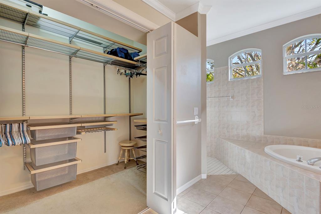 7344 Arrowhead Run Lakewood Ranch, FL 34202 - Photo 7 of 24 a bathroom with a granite countertop sink a toilet and shower