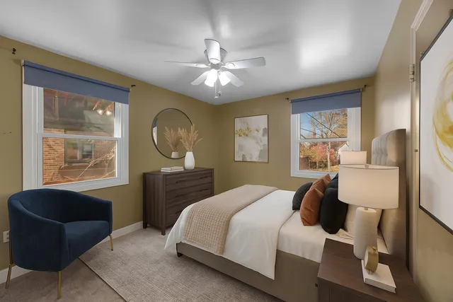 a bedroom with a bed and a couch