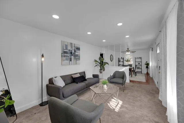 a living room with furniture and a couch