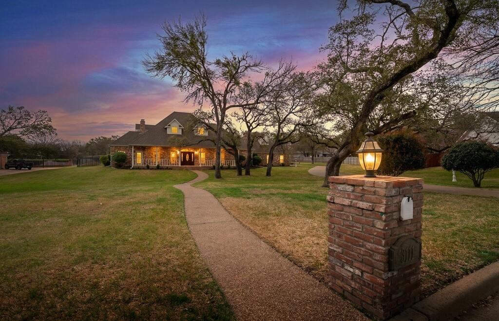 3111 Rockbridge Road Waco, TX 76657 - Photo 1 of 1 View of front of house with a front lawn and a chimney