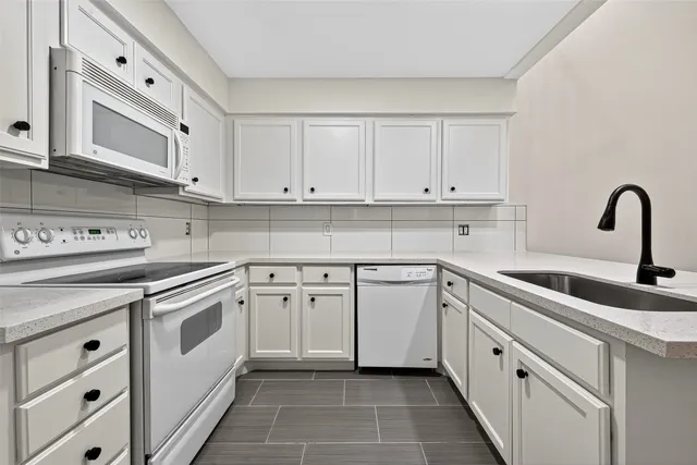 an empty room with a window and a ceiling fan
