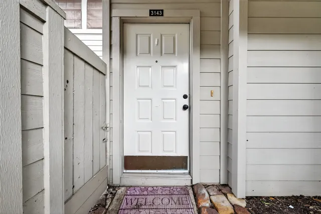 wooden floor fireplace and natural light in room