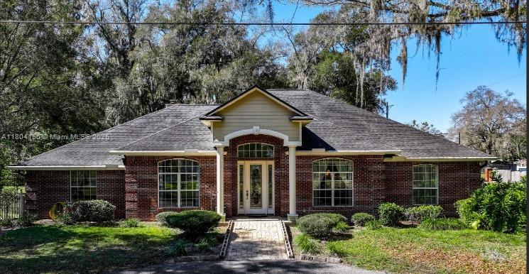 800 Permento Avenue Jacksonville, FL 32221 - Photo 1 of 29 a front view of a house with garden