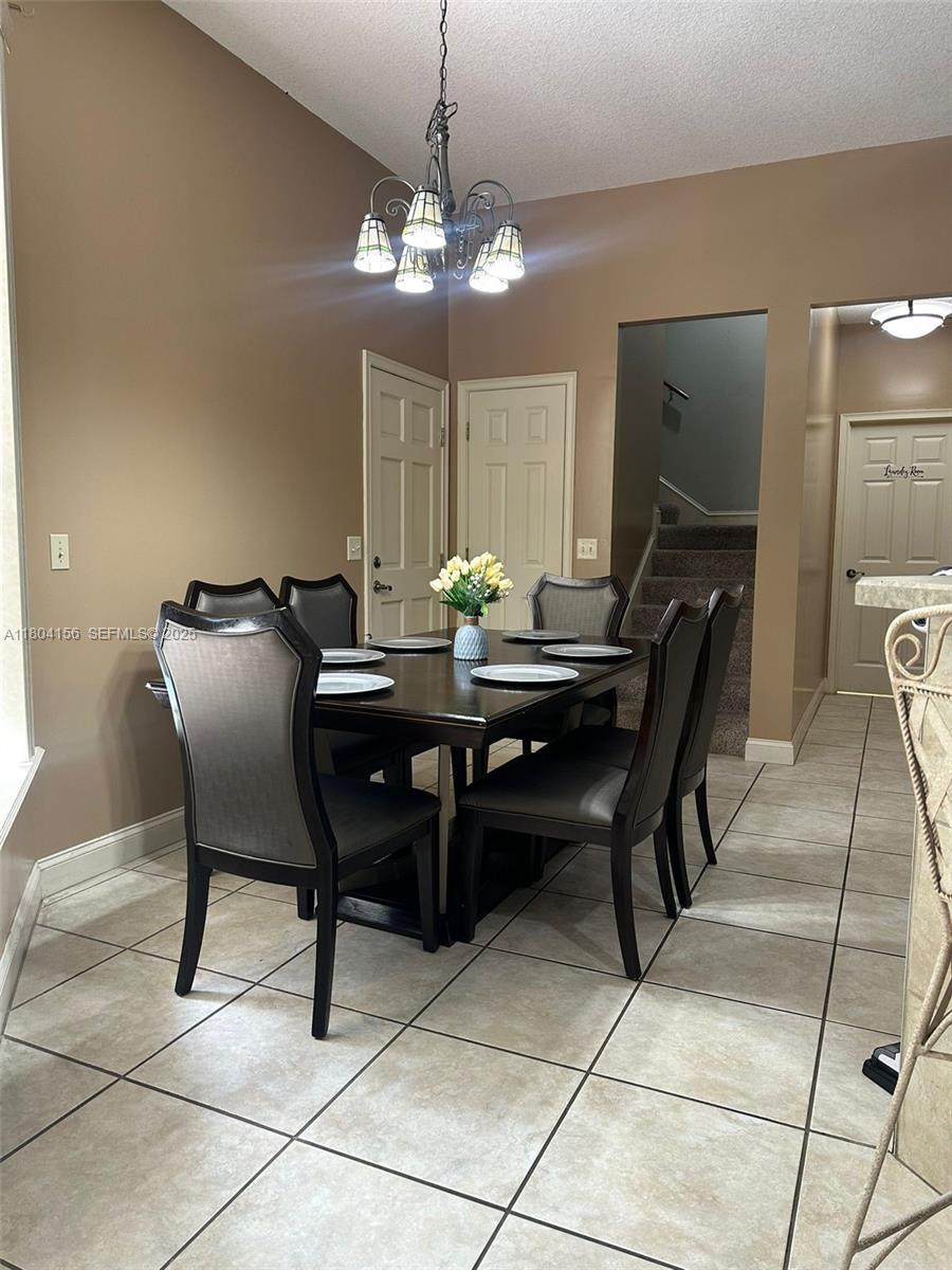 800 Permento Avenue Jacksonville, FL 32221 - Photo 12 of 29 a dining room with furniture and chandelier