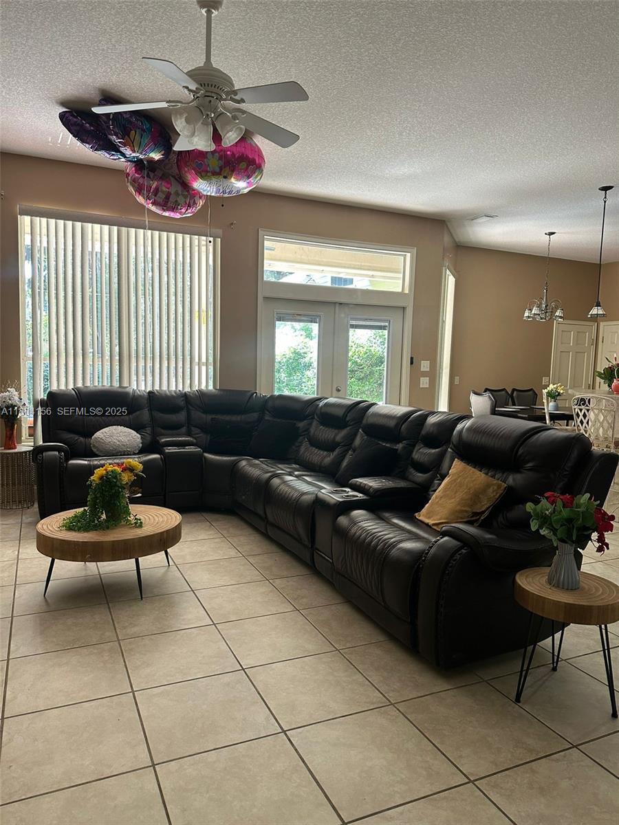 800 Permento Avenue Jacksonville, FL 32221 - Photo 15 of 29 a living room with furniture and a chandelier