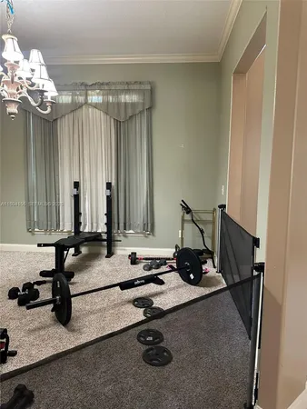a room with gym equipment and a mirror