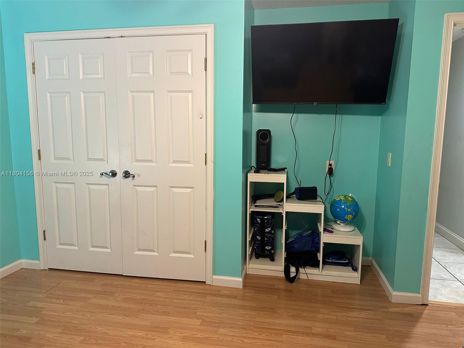 800 Permento Avenue Jacksonville, FL 32221 - Photo 25 of 29 an empty room with wooden floor mirror and staircase
