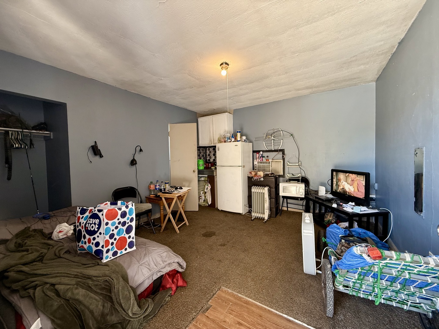 901 Highway 10 Clinton, IL 61727 - Photo 8 of 16 a living room with furniture and a flat screen tv