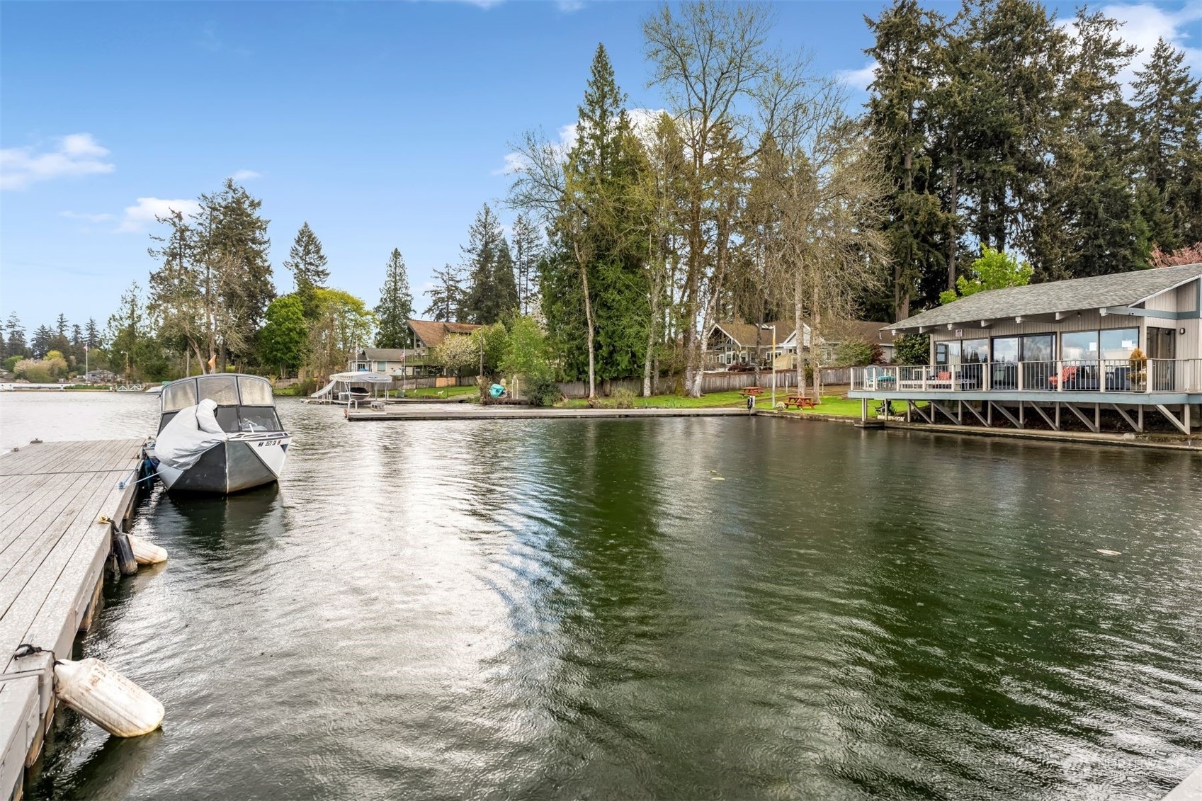 17303 Spanaway Loop Road South, Unit 2 Spanaway, WA 98387 - Photo 19 of 25 a view of a lake with houses