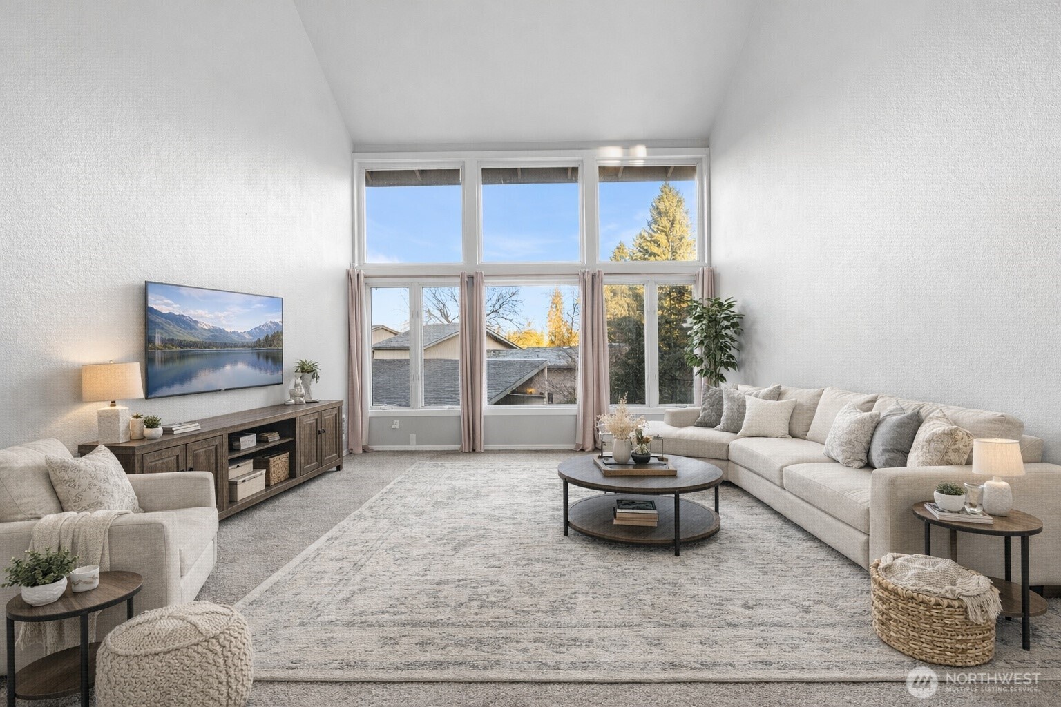 17303 Spanaway Loop Road South, Unit 2 Spanaway, WA 98387 - Photo 2 of 25 a living room with furniture a flat screen tv and a window