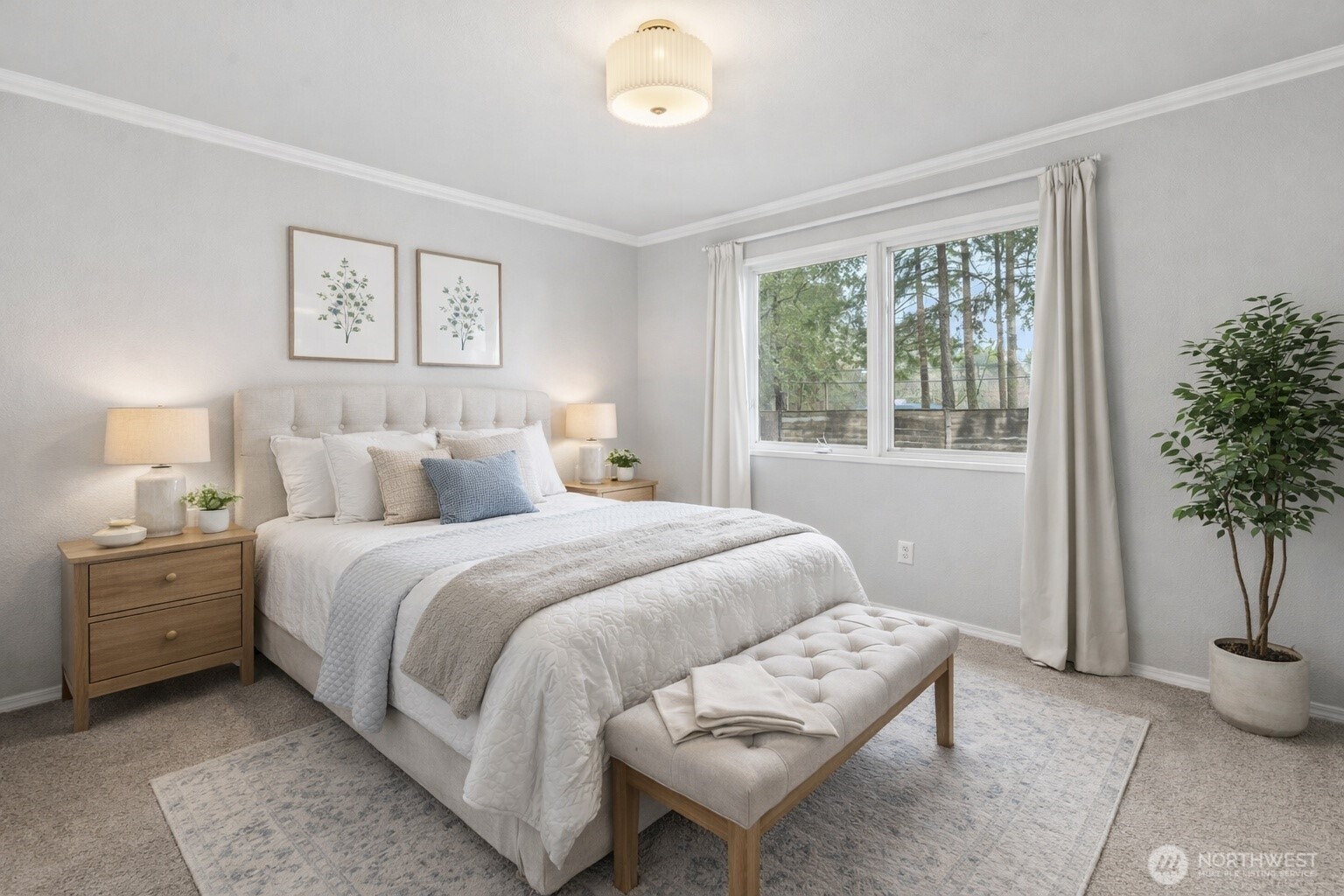 17303 Spanaway Loop Road South, Unit 2 Spanaway, WA 98387 - Photo 6 of 25 a bedroom with a bed and a potted plant