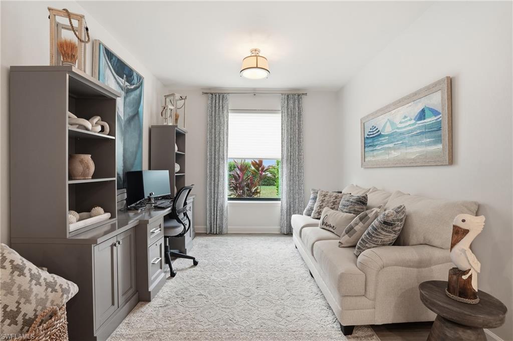 9426 Benvenuto Court, Unit 2104 Naples, FL 34119 - Photo 17 of 45 a living room with furniture and a window