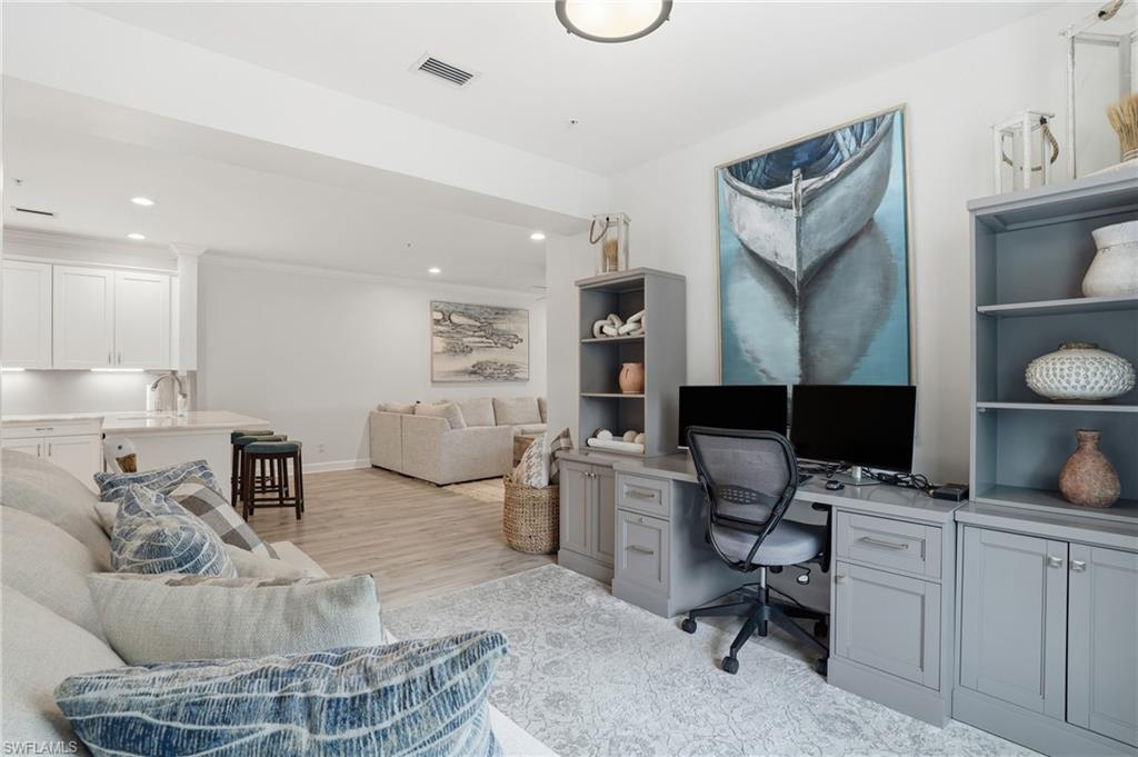 9426 Benvenuto Court, Unit 2104 Naples, FL 34119 - Photo 18 of 45 a workspace with furniture and a bathroom