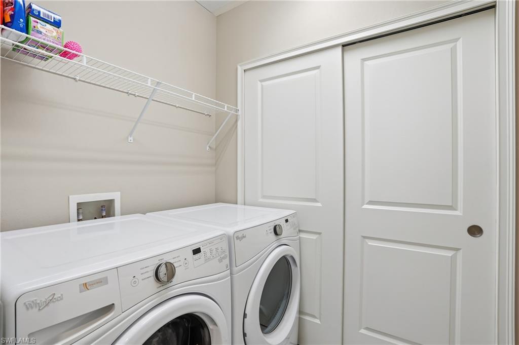 9426 Benvenuto Court, Unit 2104 Naples, FL 34119 - Photo 24 of 45 a utility room with dryer and washer