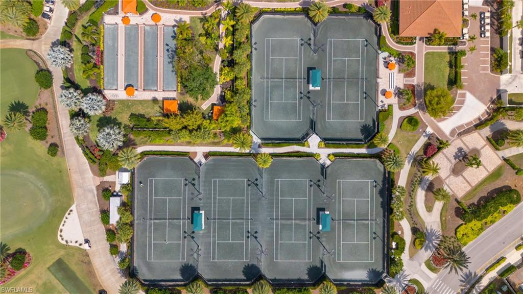 9426 Benvenuto Court, Unit 2104 Naples, FL 34119 - Photo 33 of 45 aerial view of a residential apartment building with a yard
