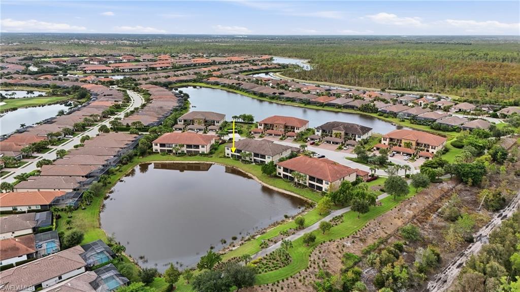 9426 Benvenuto Court, Unit 2104 Naples, FL 34119 - Photo 38 of 45 an aerial view of residential houses with outdoor space