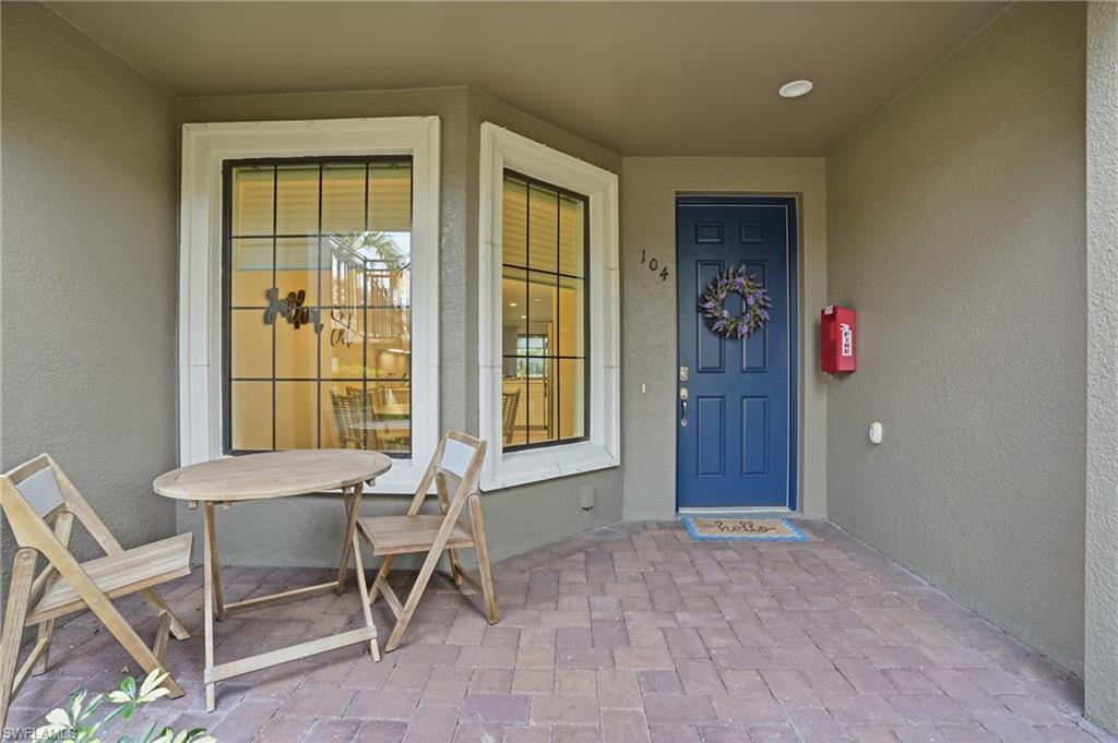 9426 Benvenuto Court, Unit 2104 Naples, FL 34119 - Photo 8 of 45 a workspace with furniture and windows