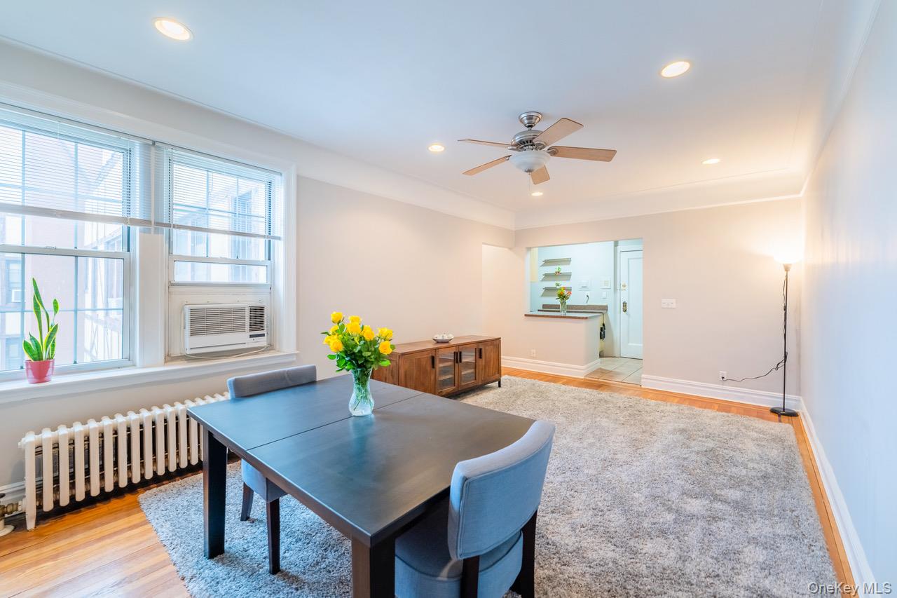 4 Maple Drive, Unit 6O Great Neck, NY 11021 - Photo 11 of 28 a view of a dining room with furniture window and wooden floor