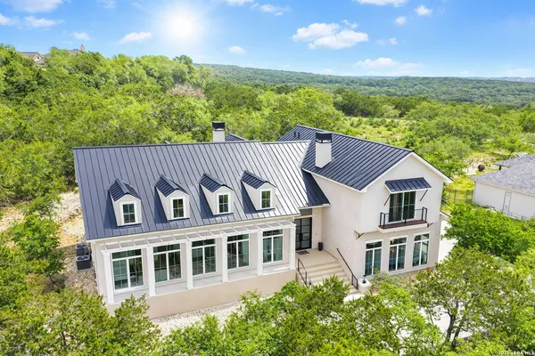 a view of a large building with a yard