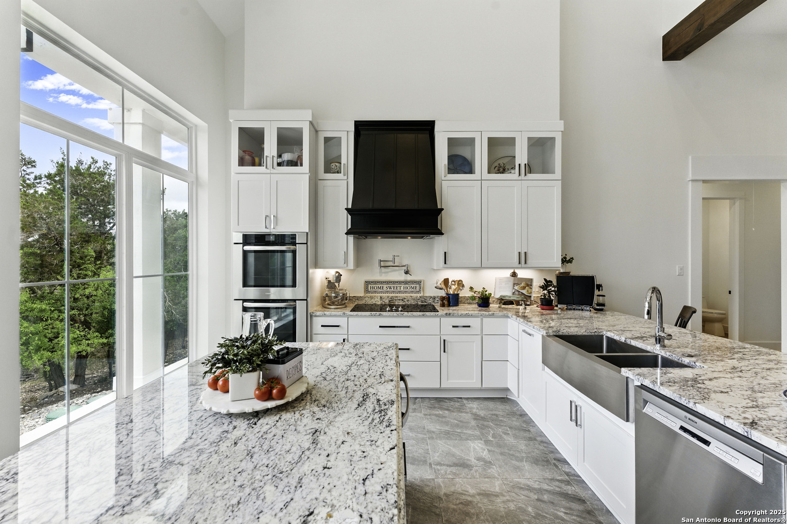 321 Bentwood Drive Spring Branch, TX 78070 - Photo 12 of 50 a kitchen with a stove a sink and a refrigerator