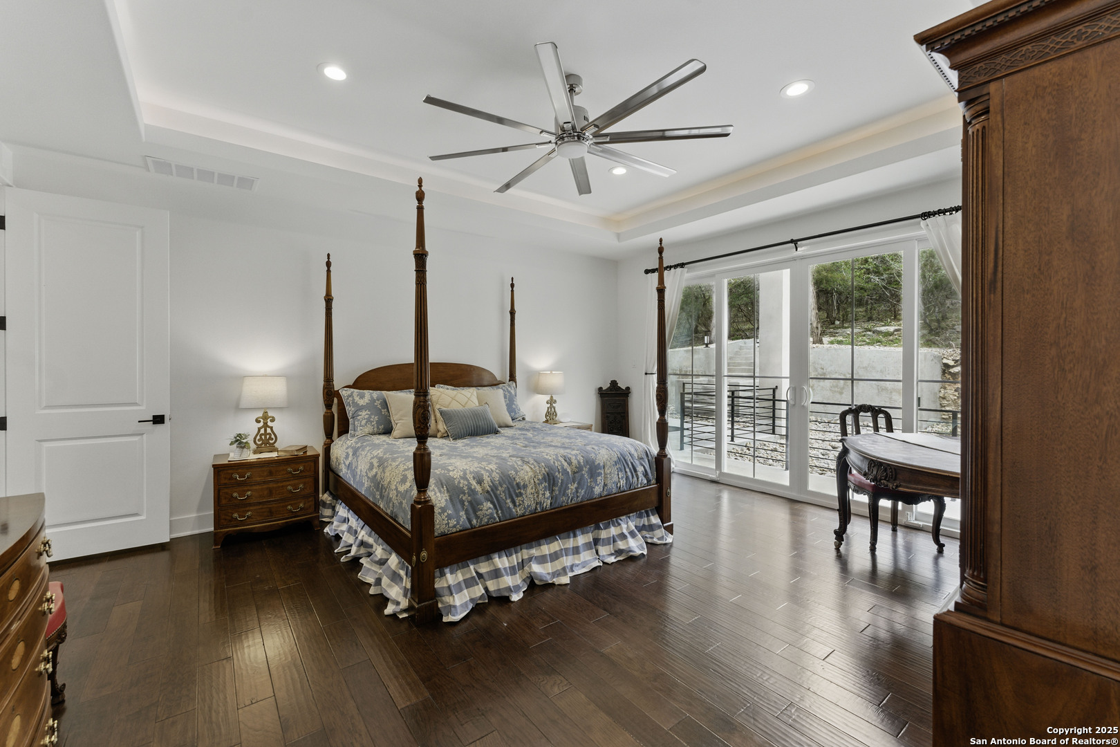 321 Bentwood Drive Spring Branch, TX 78070 - Photo 19 of 50 a bedroom with a bed and wooden floor