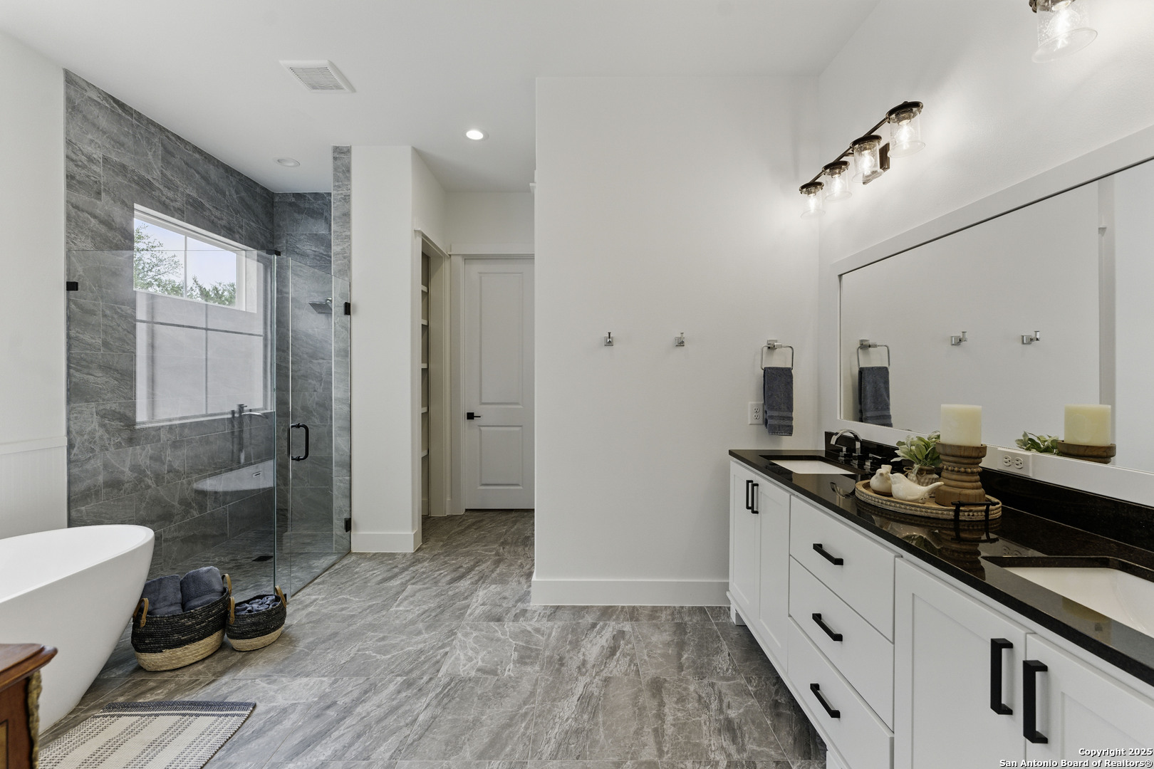321 Bentwood Drive Spring Branch, TX 78070 - Photo 22 of 50 a spacious bathroom with a granite countertop sink a toilet a mirror and shower
