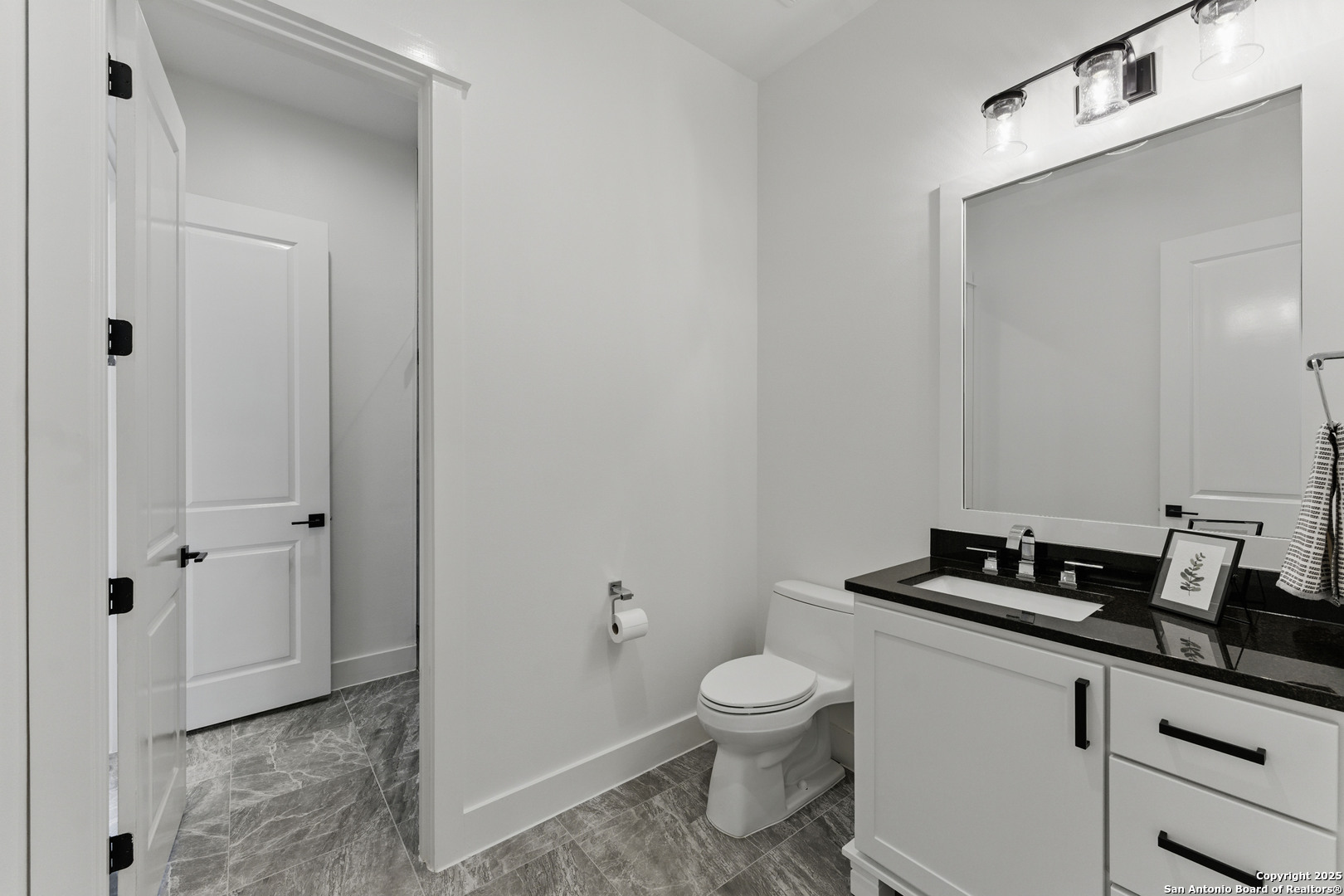 321 Bentwood Drive Spring Branch, TX 78070 - Photo 28 of 50 a bathroom with a granite countertop sink and a toilet