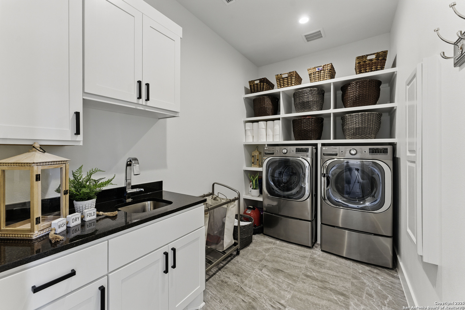 321 Bentwood Drive Spring Branch, TX 78070 - Photo 31 of 50 a utility room with sink dryer and washer