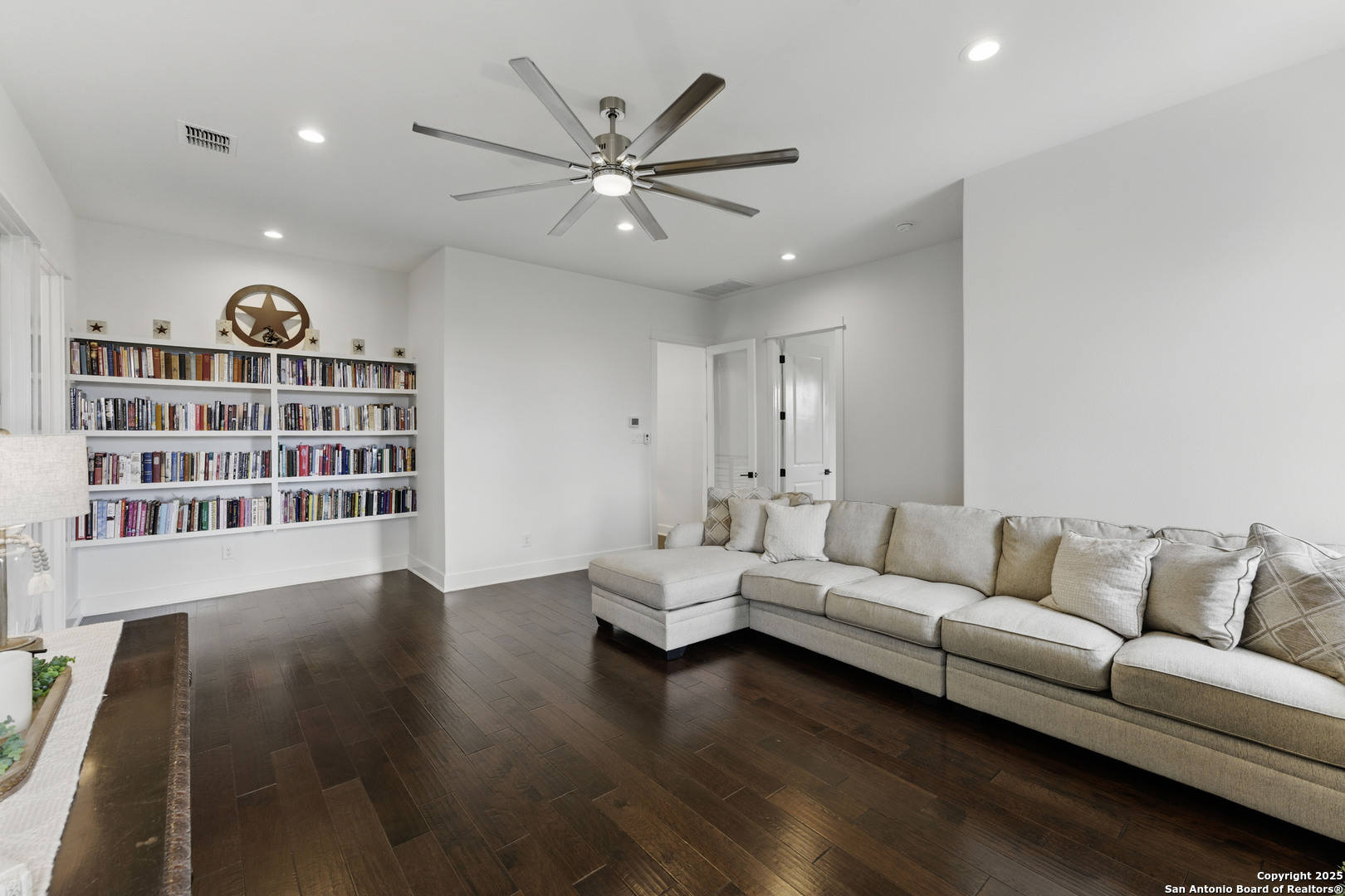 321 Bentwood Drive Spring Branch, TX 78070 - Photo 33 of 50 a living room with furniture and a book shelf